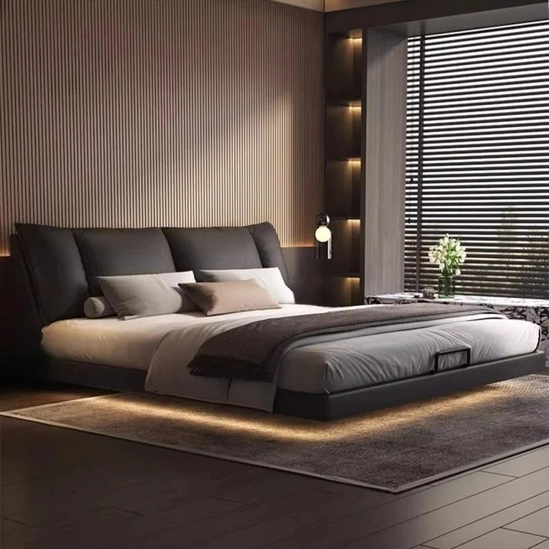 Modern leather double bed with a sleek design and quality finish in a minimalist master bedroom.