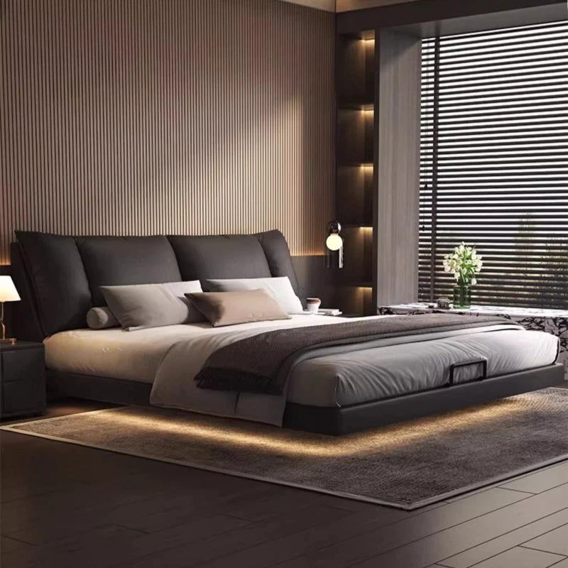 Modern leather double bed in a minimalist master bedroom setting with stylish decor and ambient lighting.