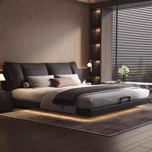 Modern leather double bed in a minimalist master bedroom setting with stylish decor and ambient lighting.