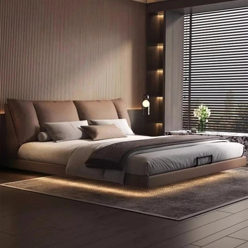 Modern leather double bed in a minimalist master bedroom design with soft bedding and elegant ambiance.